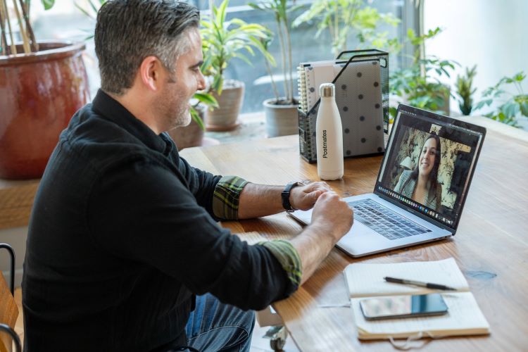 A man video calling a woman in Cambridge