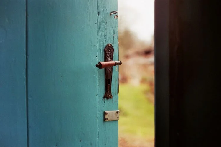 A blue door slightly ajar