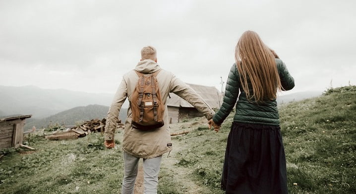 Couple walking through the countryside during outdoor therapy at a drug and alcohol rehab clinic in Durham