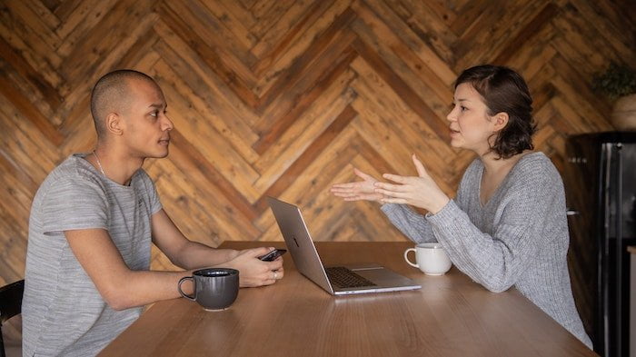 Man and woman talking at a drug and alcohol rehab centre in Dorset