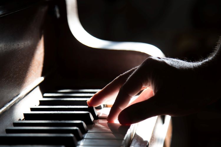 A hand playing piano