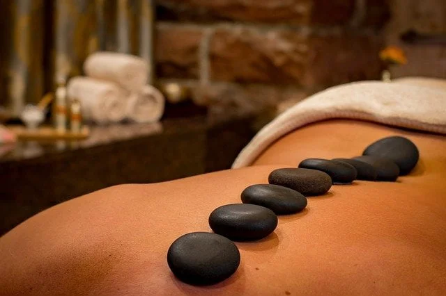 Person receiving a hot stone massage during holistic therapy at a drug and alcohol rehab clinic in Durham Person receiving a hot stone massage during holistic therapy at a drug and alcohol rehab clinic in Durham
