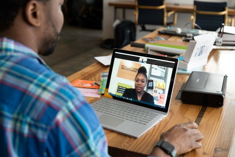 A man and woman on a video call in Croydon