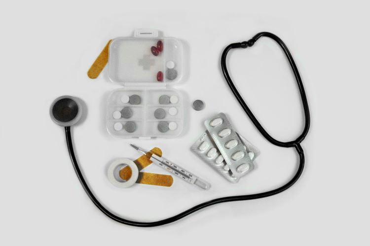 A stethoscope, pill packets and medical equipment in Manchester