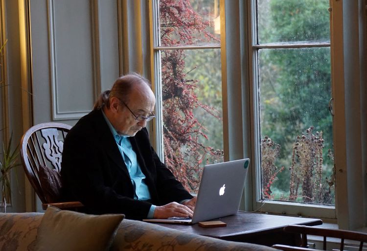 Man sitting at laptop in Buckinghamshire