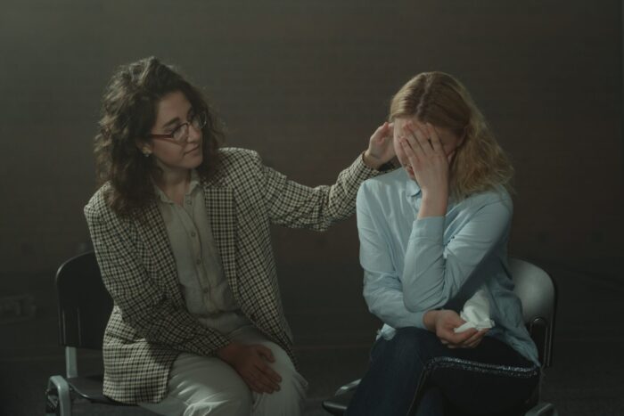 Patient being comforted by a therapist at a drug and alcohol rehab clinic in Lancaster