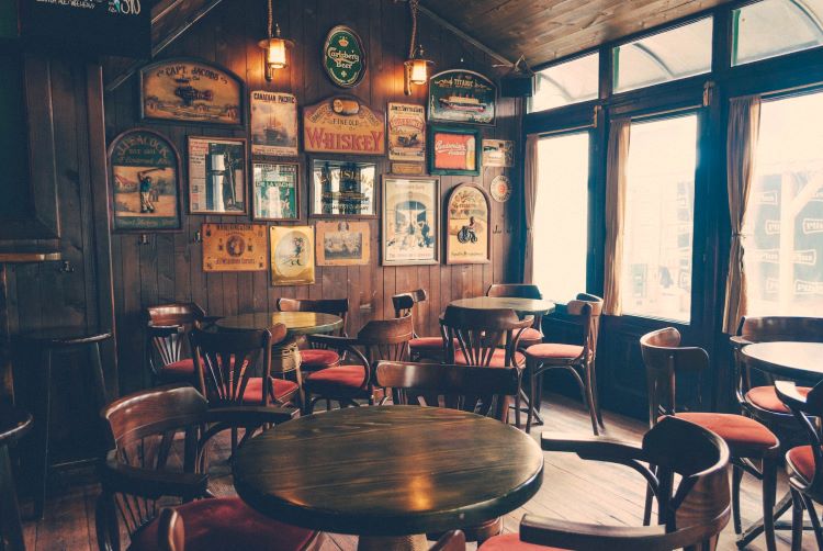 An empty pub with round tables