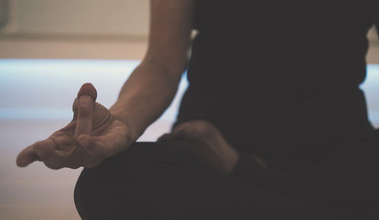 A close up of a person meditating