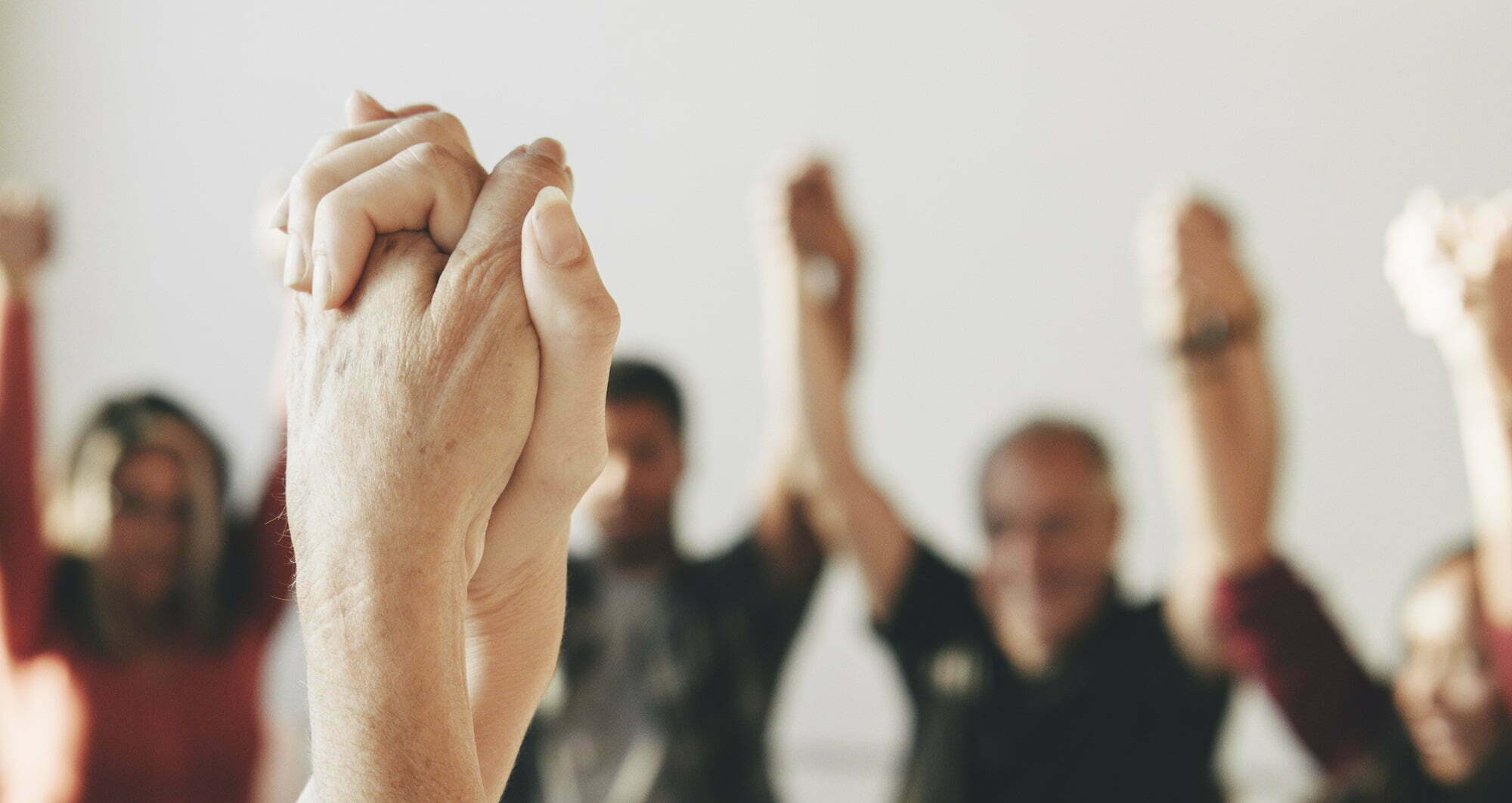 circle at rehab, people holding hands