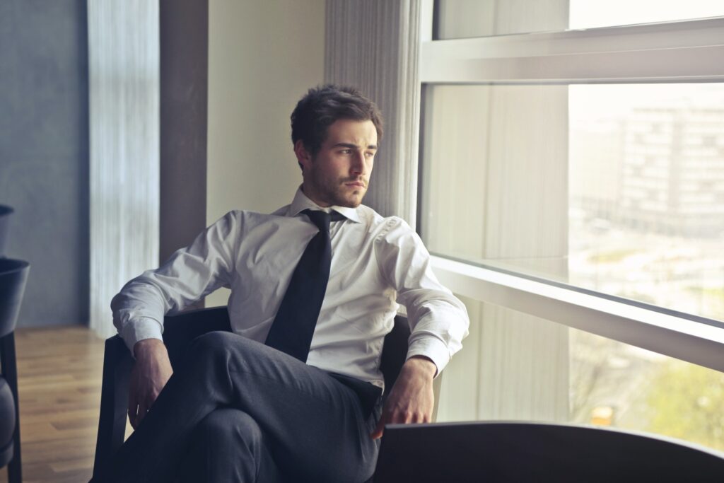 Man in a suit looking pensive in Newcastle