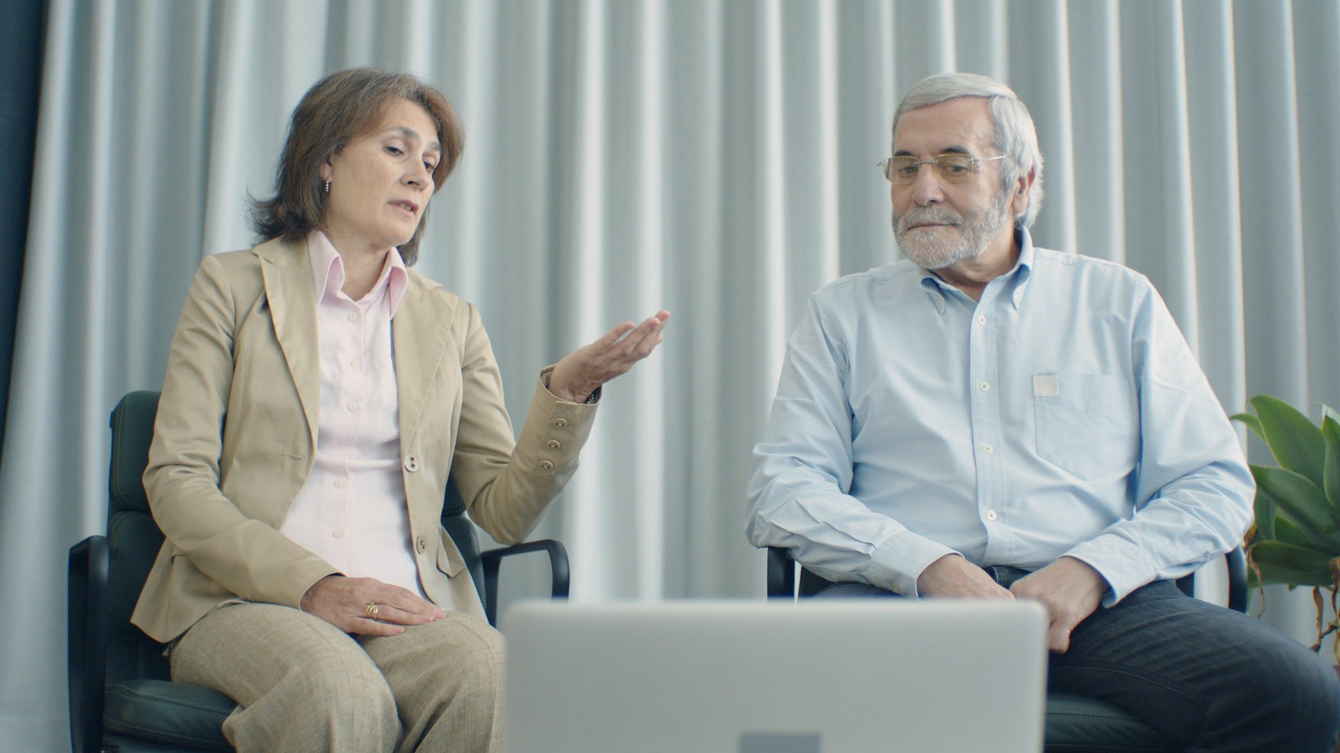 Two older people looking at a laptop in a drug and alcohol rehab in East Yorkshire