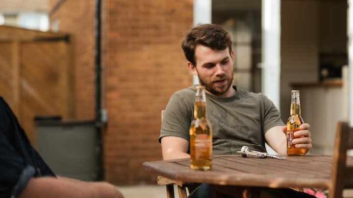 man with beer bottle