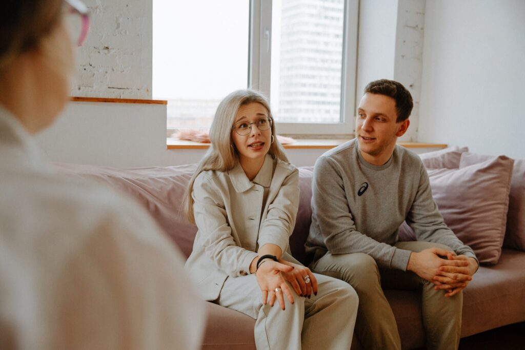 A man and a woman talking with a health professional in Buckinghamshire