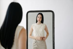 Woman looking in the mirror