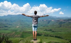 man overlooking valley