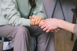 two people holding hands at rehab in East Sussex
