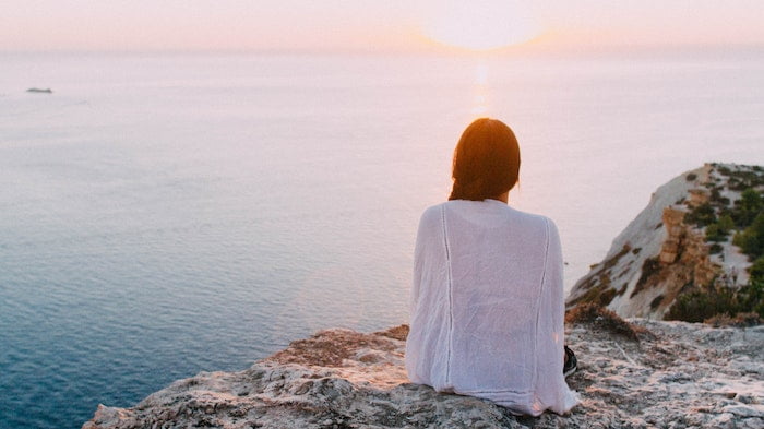 Woman watching the sun