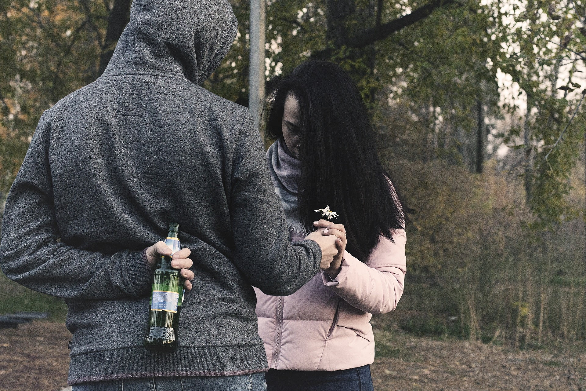 man hiding alcohol from partner