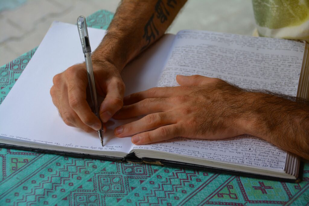 Person Writing in Journal