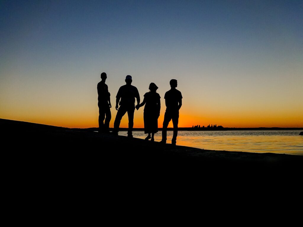 silhouette of people at the beach