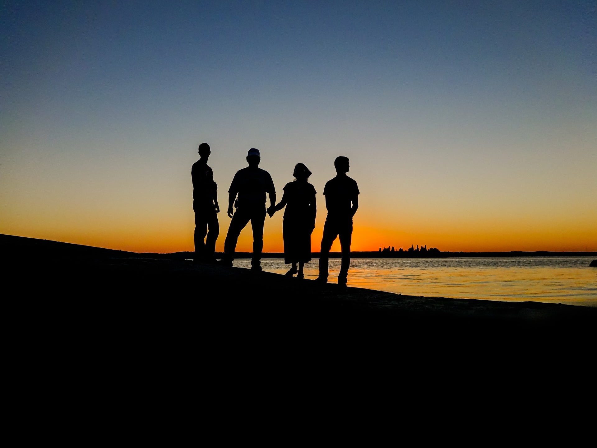 silhouette of people at the beach