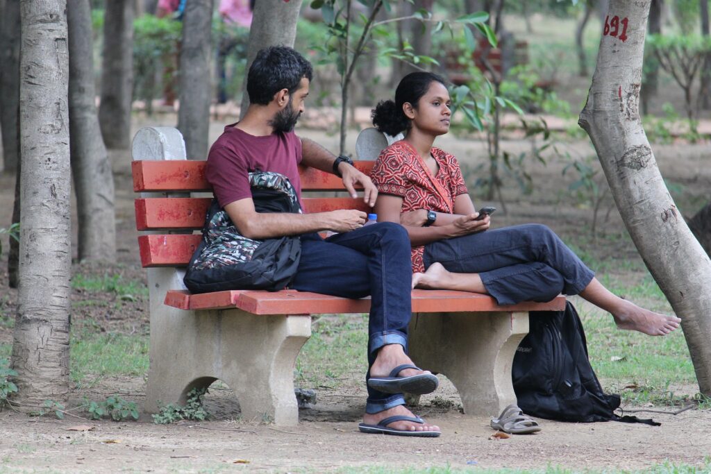 Couple sat on a bench in Surrey