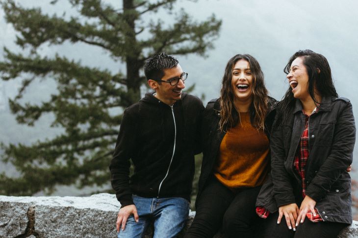 Three friends in a rural area smiling in Surrey