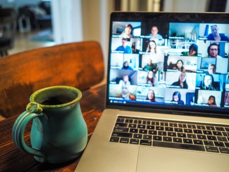 A video call with a dozen cameras on a laptop screen