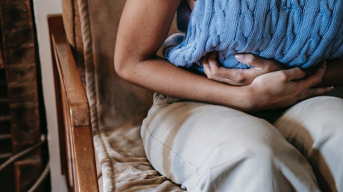 Person holding stomach