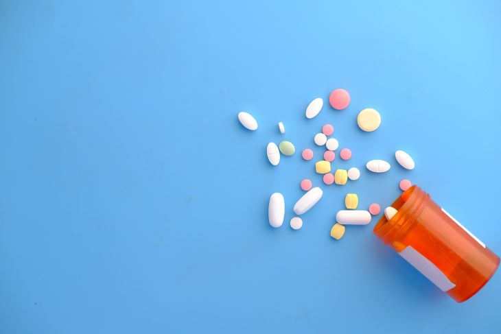 Pills spilling out of a bottle in West Sussex