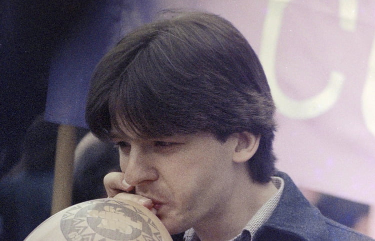 Man inhaling a balloon