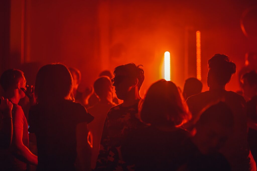 Red lit nightclub and silhouettes