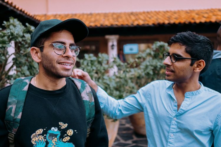Friend comforting an addiction sufferer as part of their support network