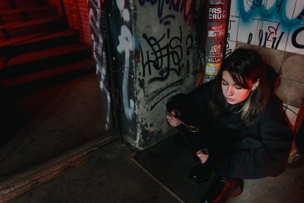 Woman sitting on a floor in Liverpool