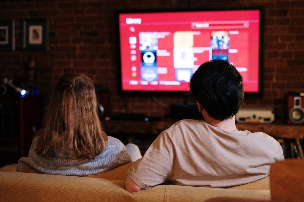 Couple watching TV in Croydon