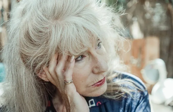 An older woman with alcohol use disorder