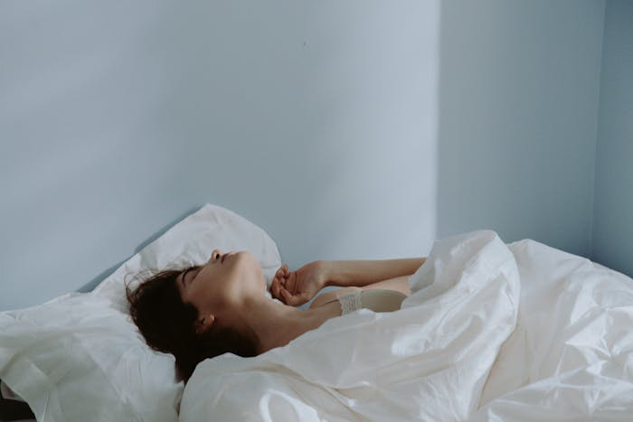 Woman detoxing at home in bed