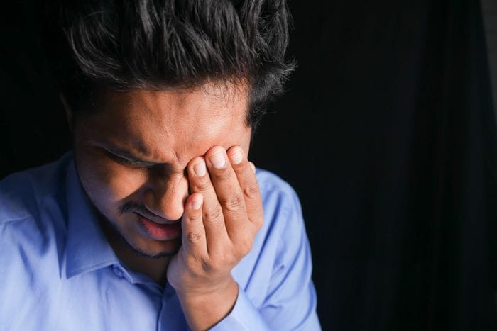 Man with spinning head, dizzy from drinking alcohol
